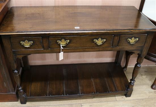 An oak dresser with pot shelf W.117cm